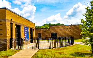 Hillsboro School building exterior with a blue sky on a sunny day